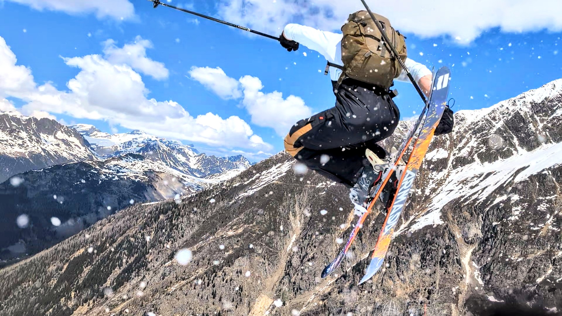 Jack mid-air on his skis above the Chamonix valley